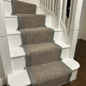 Taped stairs runner with stair rods